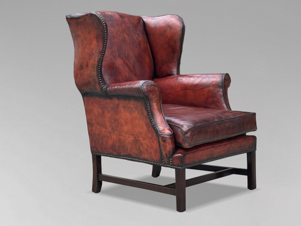 SOLD/18TH CENTURY GEORGE III BURGUNDY LEATHER WING ARMCHAIR, C1790