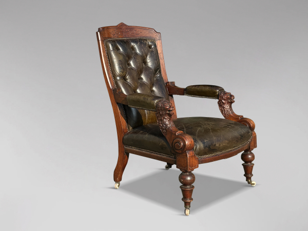 19TH CENTURY ARTS & CRAFTS CARVED WALNUT LEATHER LIBRARY ARMCHAIR,