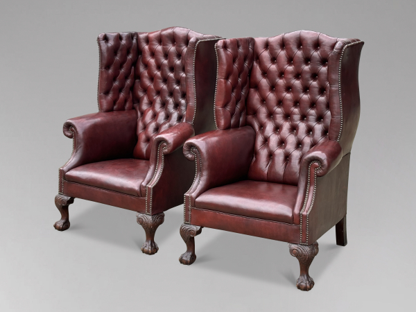 SOLD/PAIR OF ANTIQUE DEEP-BUTTONED OXBLOOD LEATHER WING ARMCHAIRS